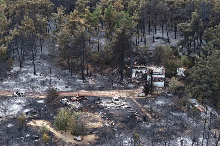 Wildfires kill a father and son in Greece and prompt evacuations in 2 villages