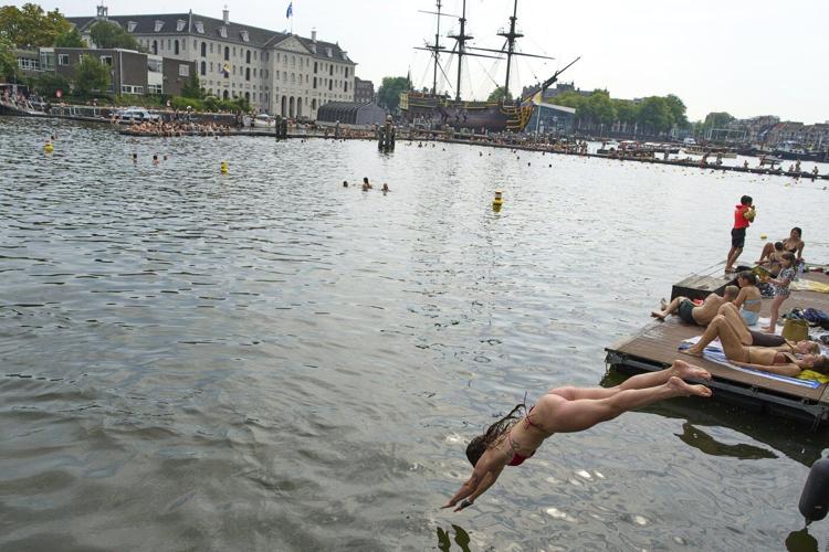 Surrounded by water, Dutch swimmers have plenty of places to cool off
