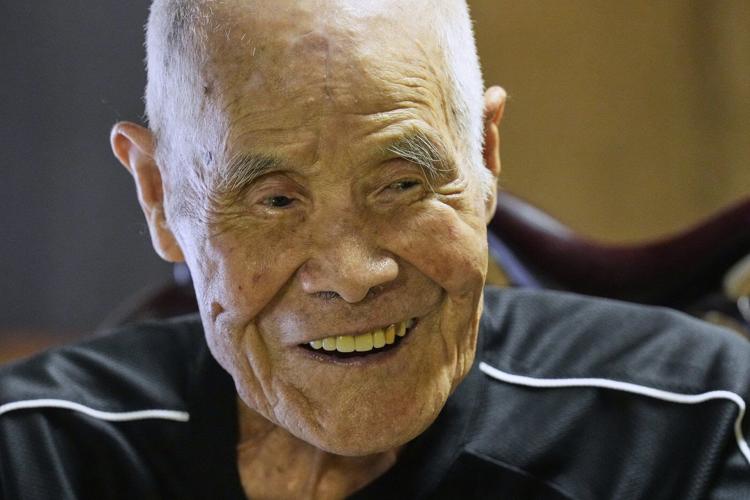 Japanese man becomes oldest to summit Mount Fuji at 102 with help from his family