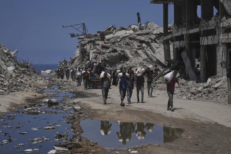 More than 100 aid groups warn of starvation in Gaza as Israeli strikes kill 21, officials say