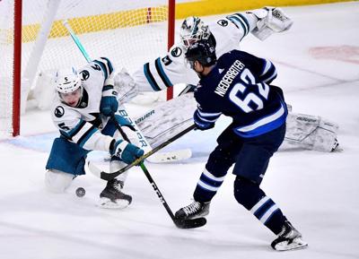 Reimer shines, Sharks rally to ground Jets 3-2 in overtime