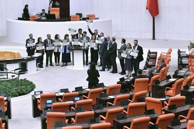 Pro-Kurdish lawmakers stage protest in Turkey's parliament to denounce the ouster of a new mayor