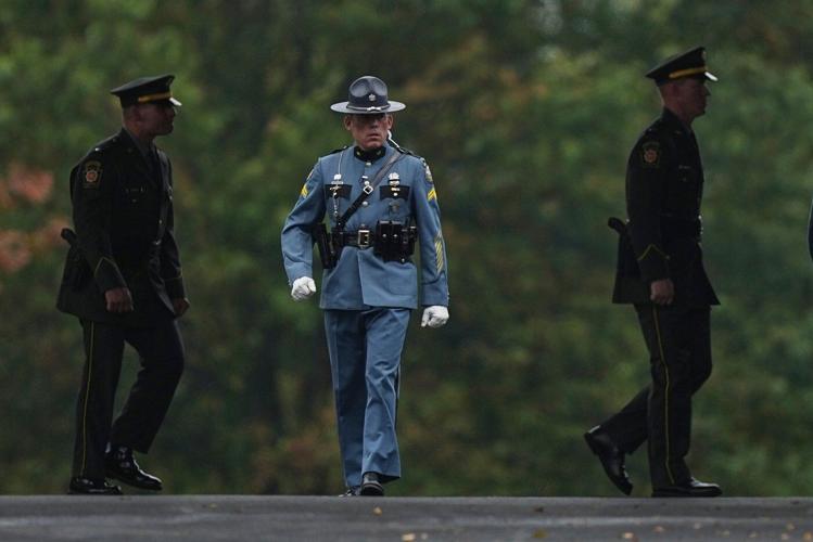 Police gather for the funeral of 3 Pennsylvania detectives ambushed by gunman