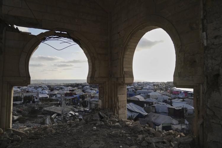 At least 60 people killed by Israeli strikes in Gaza as Israel lets minimal aid in