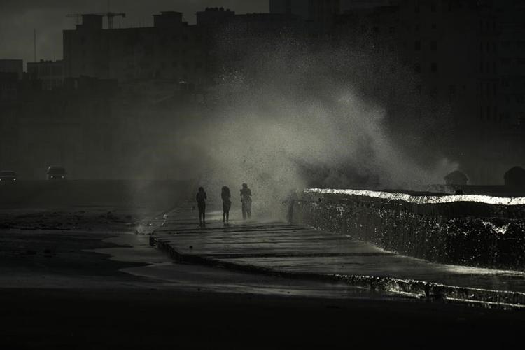 Storm causes at least 6 deaths in Cuba, where a long power outage is raising tempers