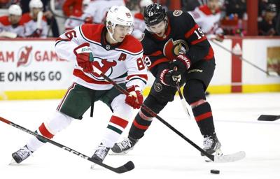 Devils defeat Senators 5-3, clinch playoff berth