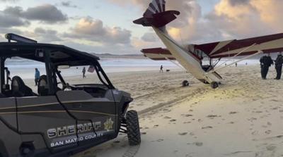 Man charged with stealing small airplane that crashed on a California beach