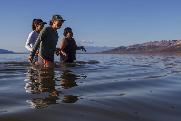 Kayakers paddle in Death Valley after rains replenish lake in one of Earth's driest spots