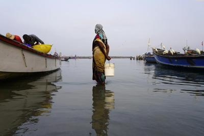 A cyclone-hit Indian hamlet pins its hopes on a sea wall
