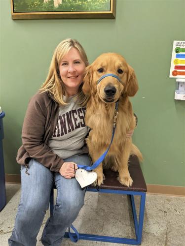 A slain Minnesota lawmaker's beloved dog, Gilbert, stays with her as she and her spouse lie in state