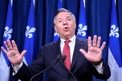 Quebec premier says moving forward on politicians' $30K pay bump requires "courage"