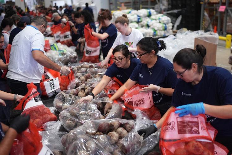 Photos of Americans turning to food pantries as shutdown drags on