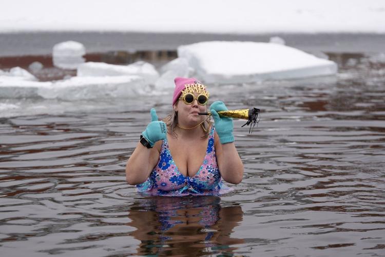 Many mark the new year with 'exhilarating' polar dip in icy water