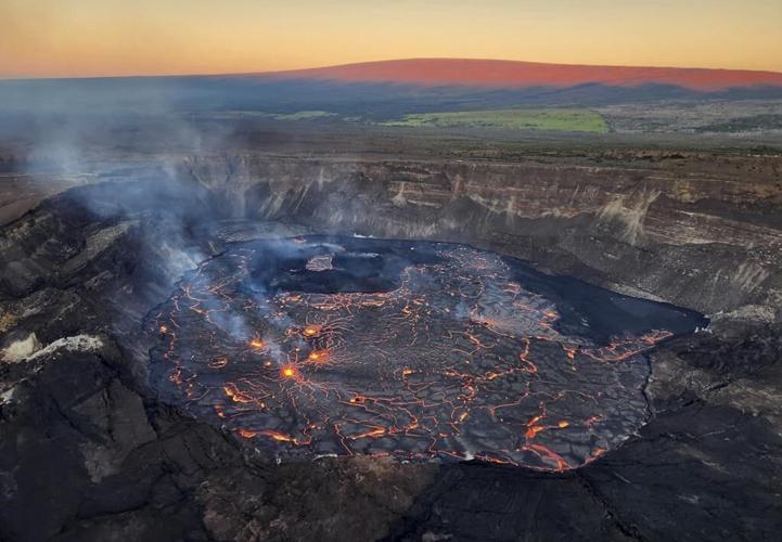 Hawaii volcano eruption continues as alert level lowered