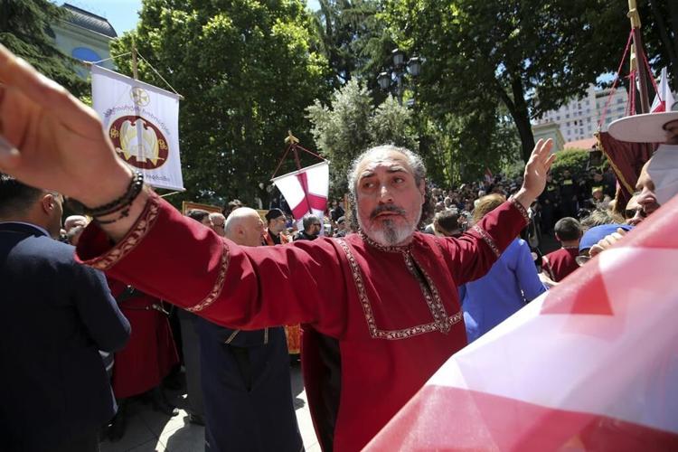 Georgia's prime minister joins tens of thousands in a march to promote 'family purity'