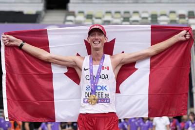 World race walk champion Evan Dunfee pulls out of men's 20k event with hamstring tear