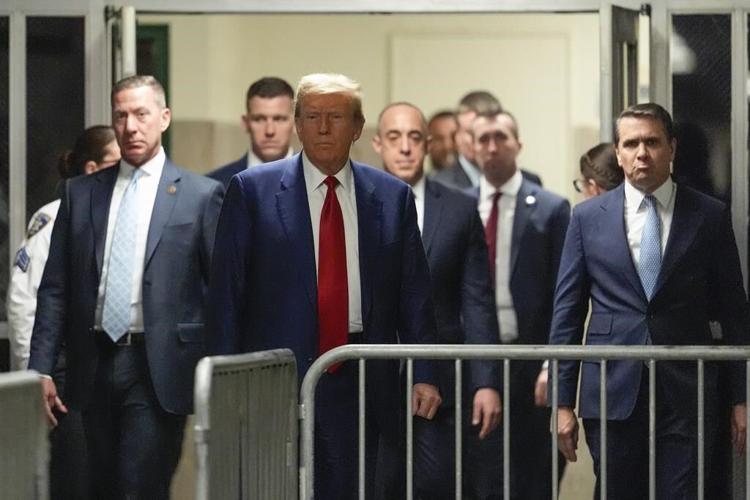 Trump arrives at court for a hearing in his hush money case after new evidence delayed his trial