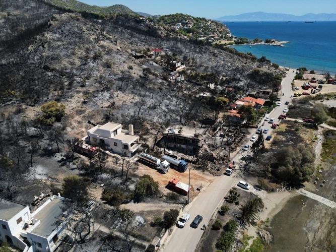 Belgian wildfire approaches Germany despite rain as Greece probes deadly blaze