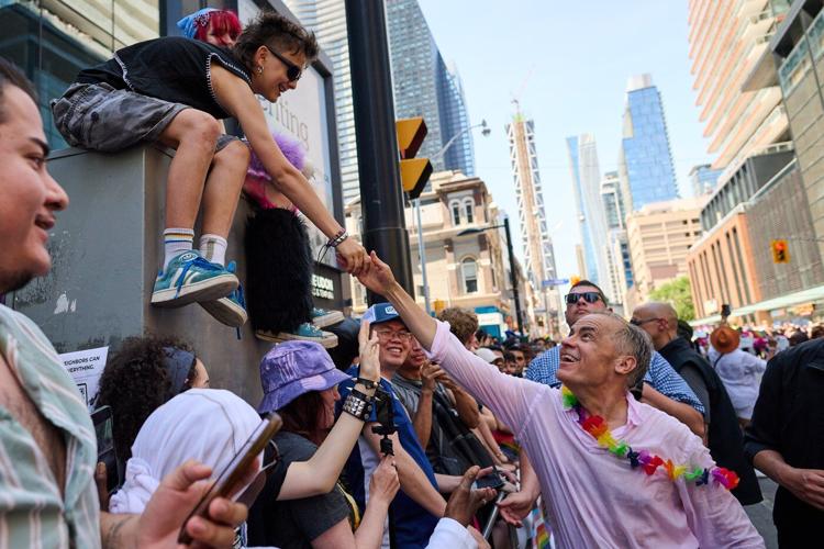 Revellers drench Mark Carney with water as Toronto celebrates Pride Parade
