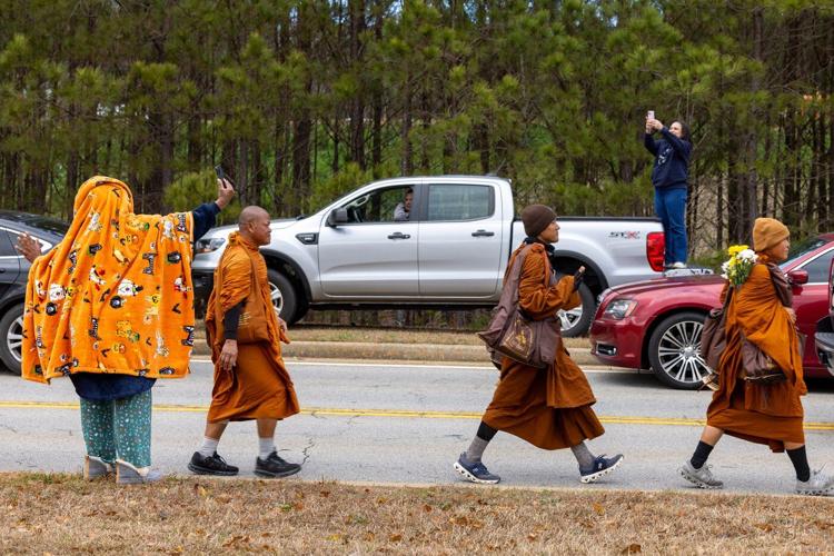 Buddhist monks persist in peace walk despite injuries as thousands follow them on social media