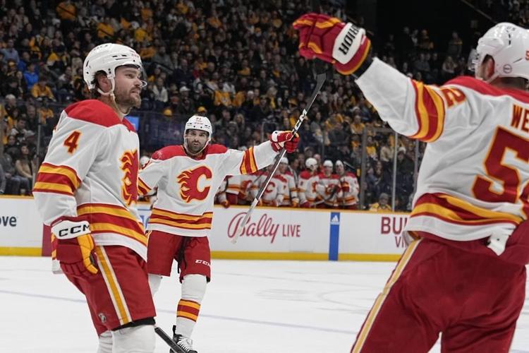 Flames score 4 goals in 1st, beat Predators 6-3 for 3rd straight win