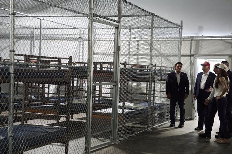 Trump tours Florida immigration lockup and jokes about escapees having to run from alligators