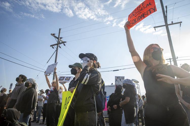 Protesters try to block vehicles at key immigration building in suburban Chicago