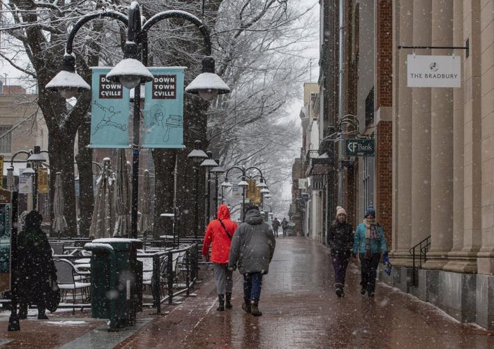 Snow and freezing rain pummel the mid-Atlantic while California prepares for likely flooding