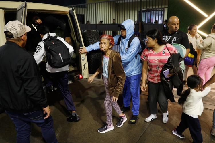 Photos show residents evacuating after explosions in Caracas, Venezuela