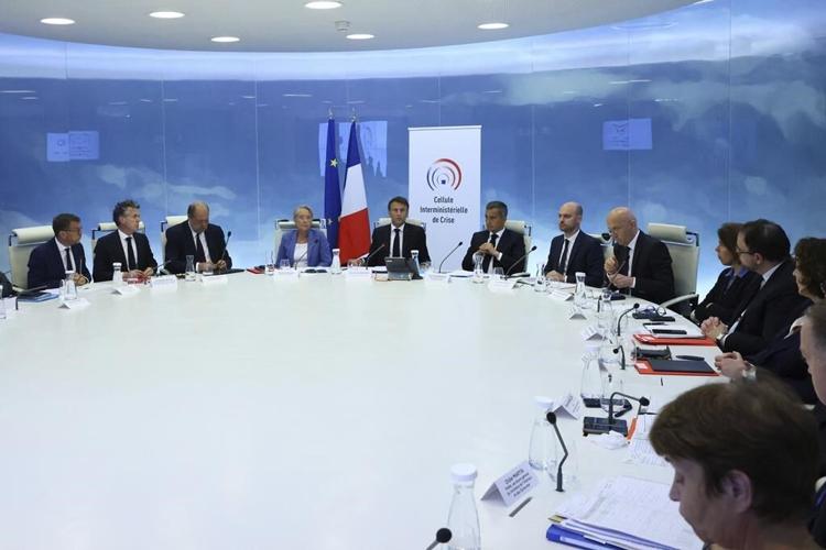 French president urges parents to keep teens at home as government orders buses to stop at 9 p.m.