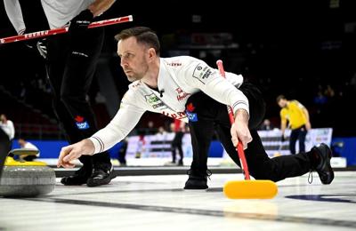 Canada's Gushue splits games, qualifies for playoffs at world curling championship