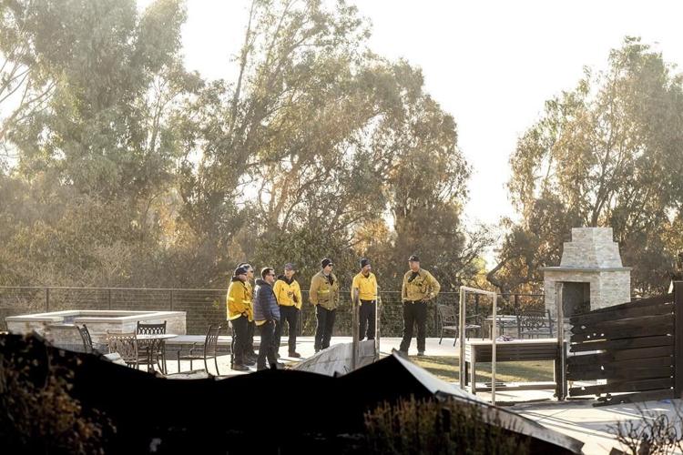 Southern California firefighters make progress against wildfire as fierce winds start to subside