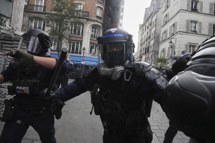 Protesters block roads and start fires across France to challenge the new prime minister, in photos
