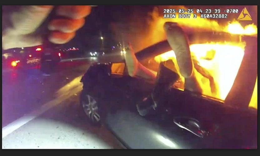 Officer rescues woman from burning car in aftermath of interstate crash in Phoenix