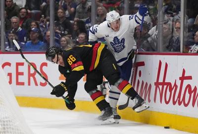 Canucks sign defenceman Christian Wolanin to two-year, two-way extension