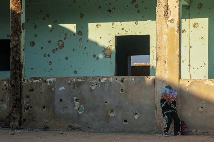 Photos show Syrian students returning to schools stripped bare by conflict