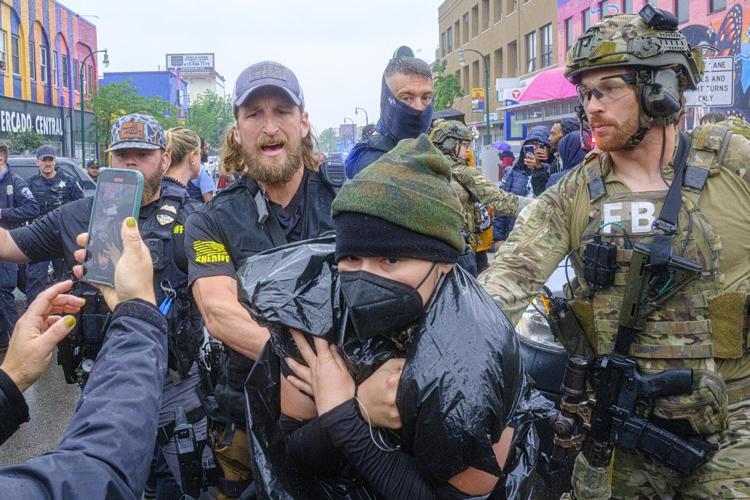 Federal officers in tactical gear went into a Latino community in Minneapolis. A protest followed