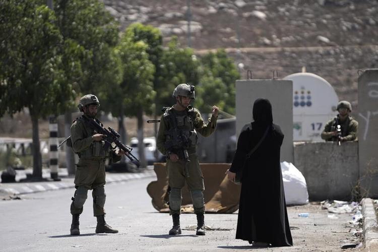 Palestinians clash with own security forces in a West Bank refugee camp, leaving 1 dead