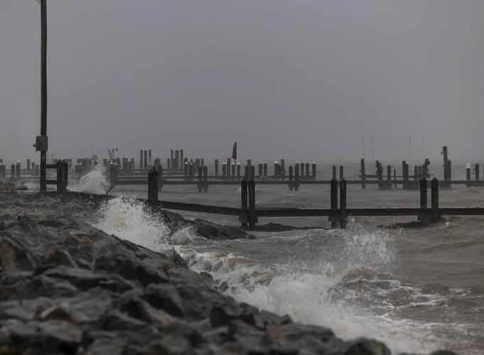 Mid-Atlantic coast under flood warnings as Ophelia weakens to post-tropical low and moves north