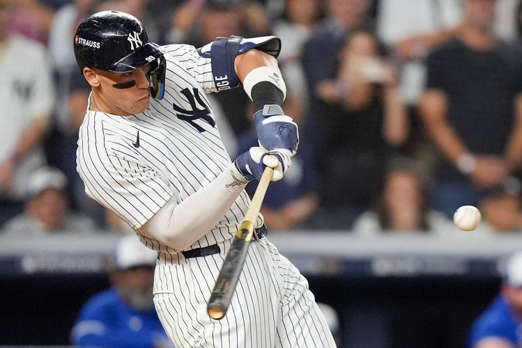 Judge rallies Yankees past Blue Jays 9-6 to save season and avert ALDS sweep