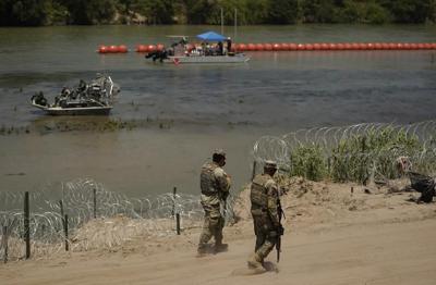 Justice Department tells Texas that floating barrier on Rio Grande raises humanitarian concerns
