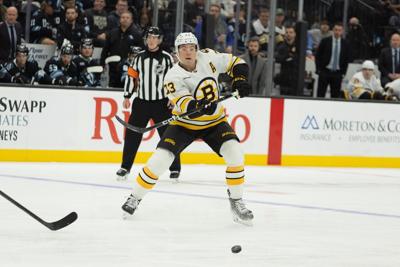 Bruins' Charlie McAvoy exits game against Canadiens after receiving shot to face