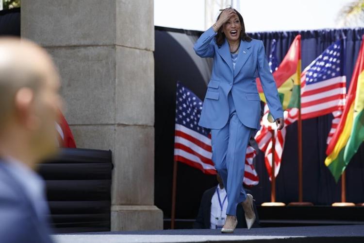 Harris in Africa looks to painful past, innovative future
