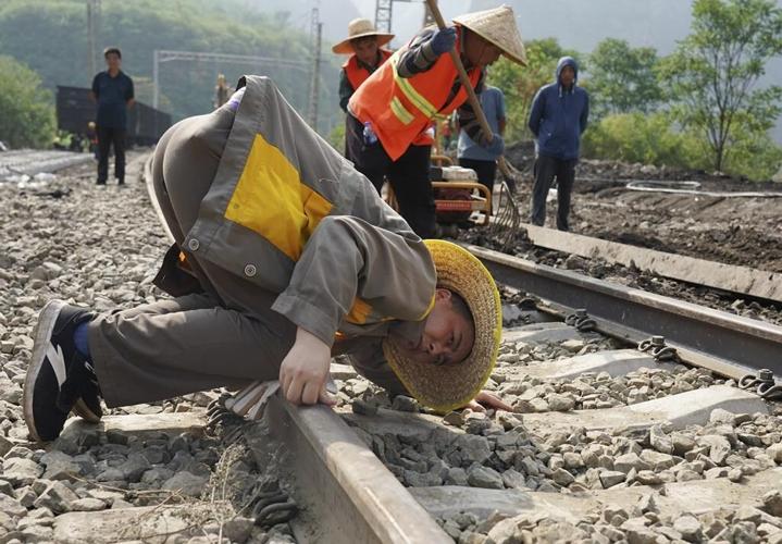 A mudslide kills at least 2 in China while rain from Khanun cancels some trains in the northeast