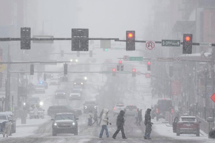 People brace themselves for the winter storm moving across the US, in photos