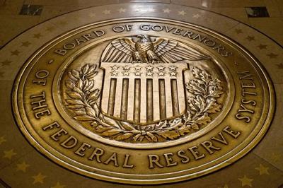 Top Federal Reserve official says inflation fight seems nearly won, with rate cuts coming