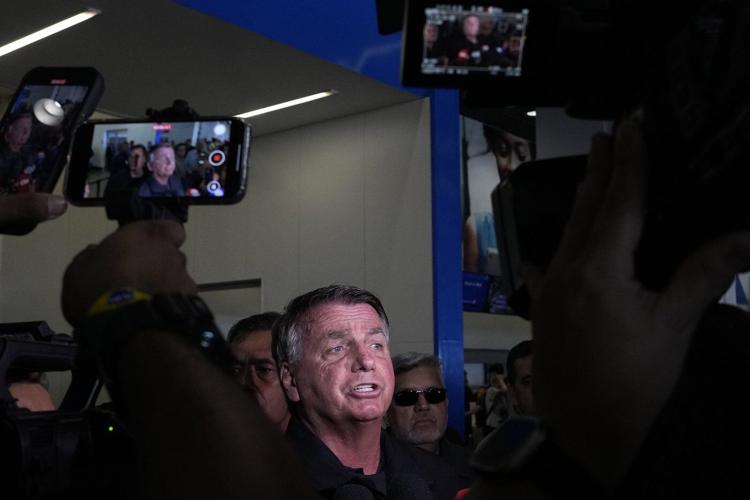 Banned from traveling, Brazil's Bolsonaro sees off his wife heading to Trump’s inauguration