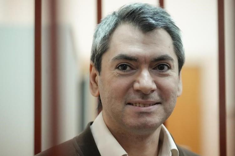 Jailed leader of a prominent election watchdog is on trial in Russia