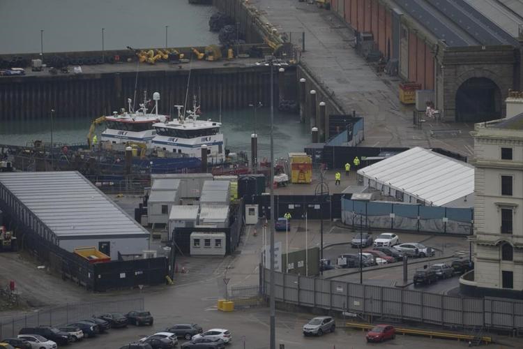 Why are migrants in small boats a heated issue in the UK?