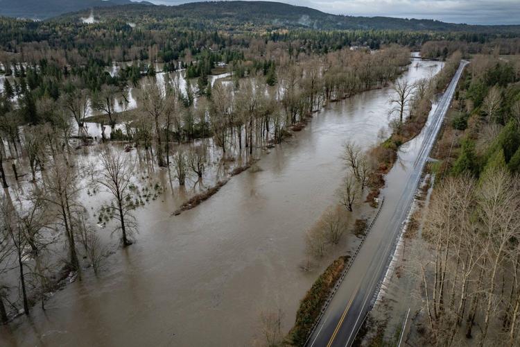 Storms bring heavy rain to the Pacific Northwest, snow and freezing rain to the Upper Midwest